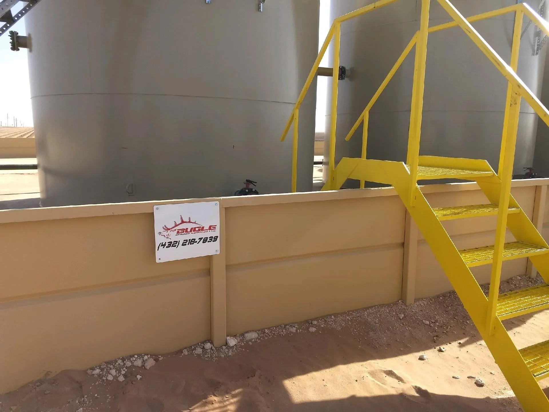 Tank Pads in Midland - TX under construction as equipment shapes and compacts a prepared industrial base