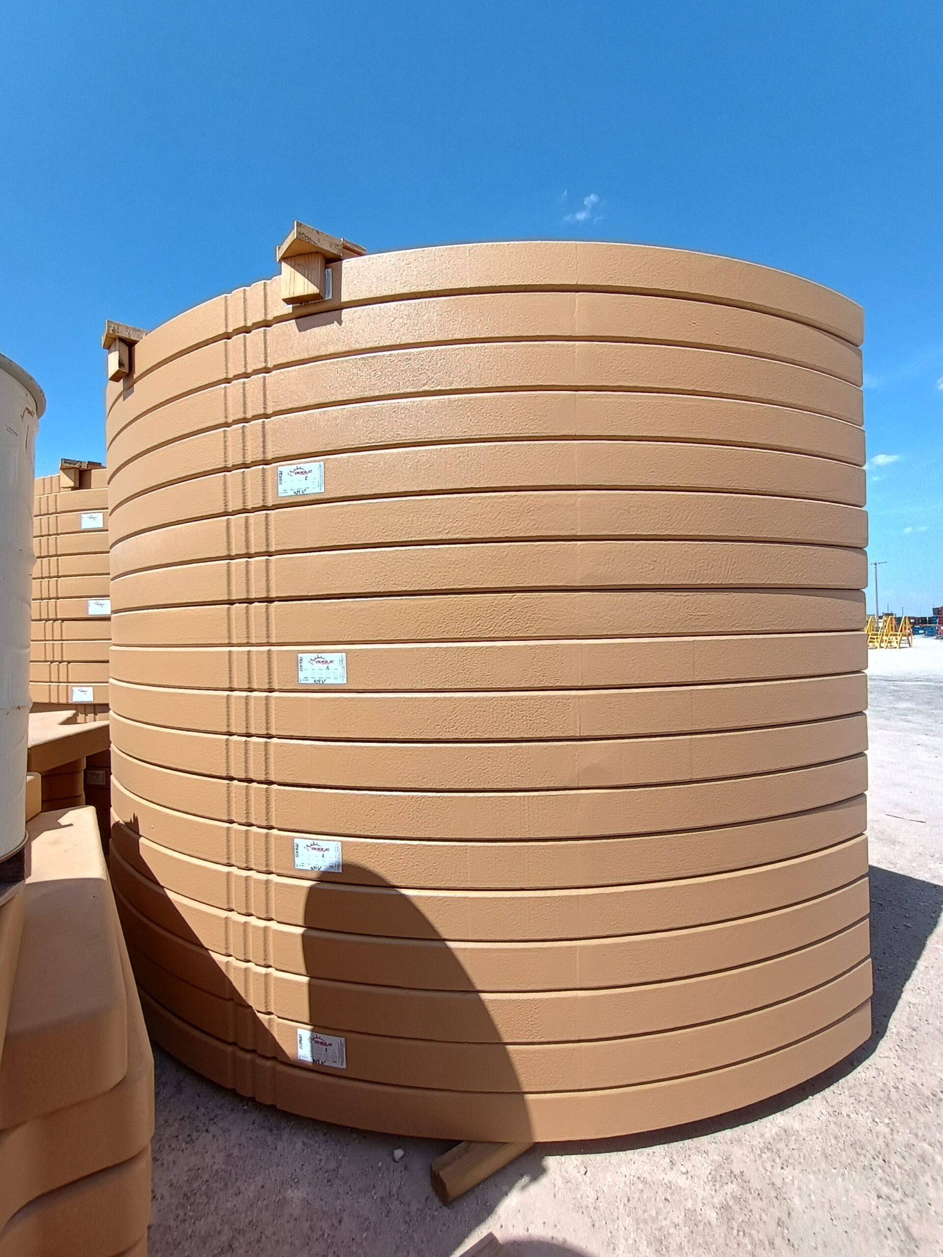 Secondary Containment in Midland - TX surrounding storage equipment on an active industrial yard